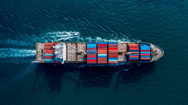istock Aerial view container ship global business logistics import export worldwide, Container cargo ship commercial trade transportation open sea, Container cargo freight shipping. 1323430167