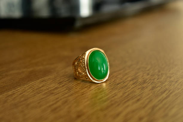 istock jewelry is a jade ring, a gold ring. 1323432940