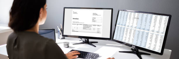 istock Businesswoman Calculating Invoice On Computer 1323434093