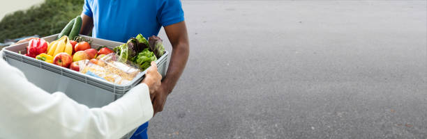 istock Grocery Delivery Courier At Home 1323434104