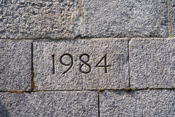 istock Stone wall of bridge foundation with year 1984 engraved. 1323440376