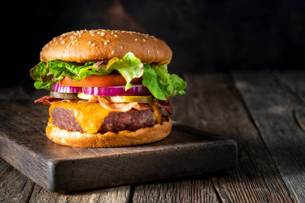 Cheeseburger Burger Patty classic on rustic board of wood