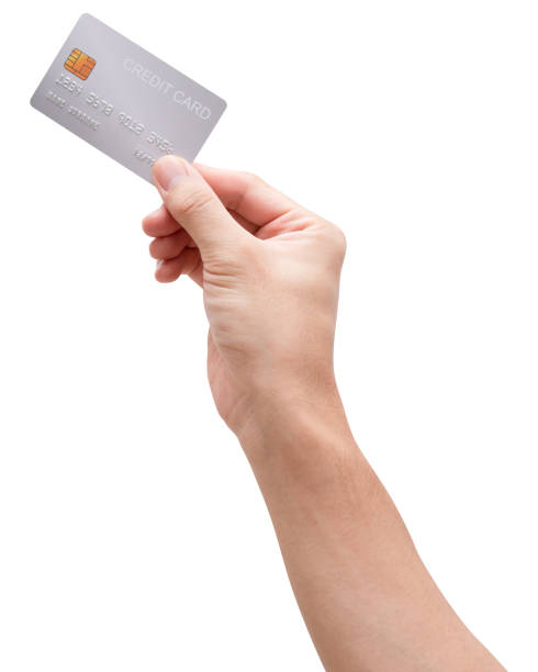 istock Male hand hold silver platinum credit card isolated on white background. 1323443339