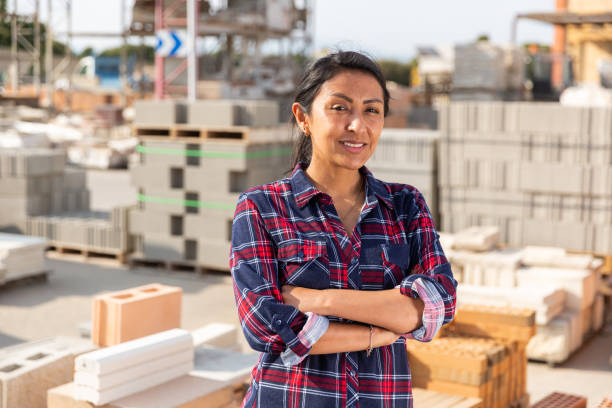 istock Woman worker posing at building materials warehouse 1323443566