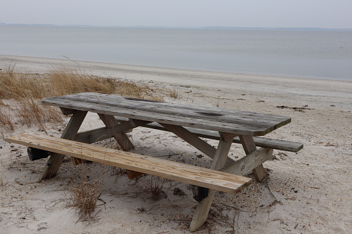 A table on a beach from Delaware. The day is calm.