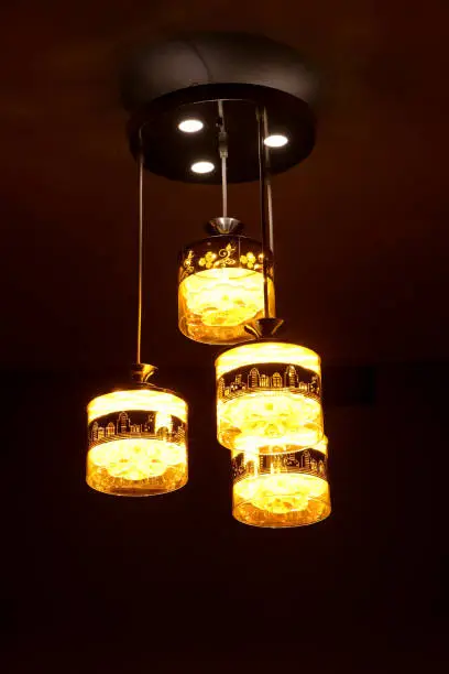 photo of bright orange-yellow lamps taken in the night under low light in the dark