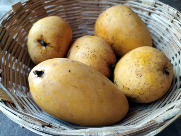 istock fresh sweet yellow mango put in a basket 1323447611
