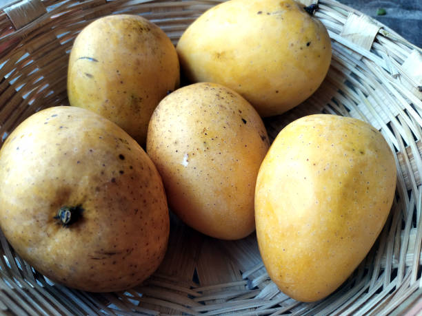 istock fresh sweet yellow mango put in a basket 1323447615