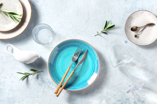 istock Trendy tableware with a blue plate, shot from the top. Dinnerware set for dinner 1323451035