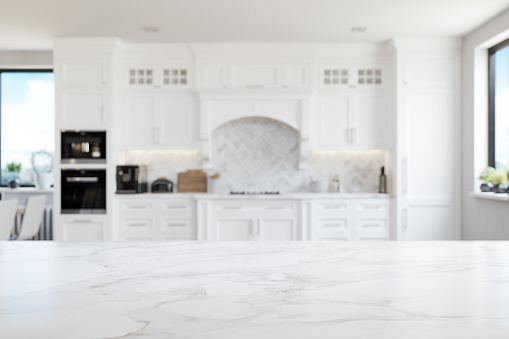Empty white marble kitchen countertop with copyspace. Focus on foreground.