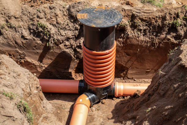 Sewage system. Plastic tubes and aka. Excavated trench or pit Sewage system. Plastic tubes and aka. Excavated trench or pit. sewer system stock pictures, royalty-free photos & images