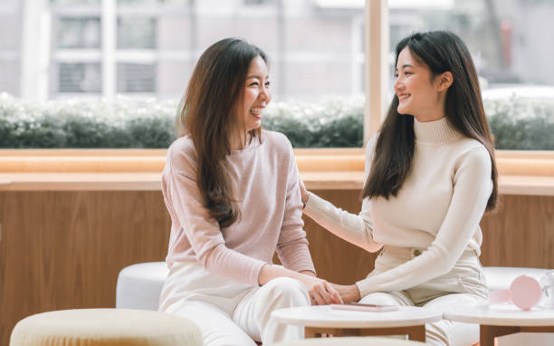 istock Women talking together in coffee shop 1323456311