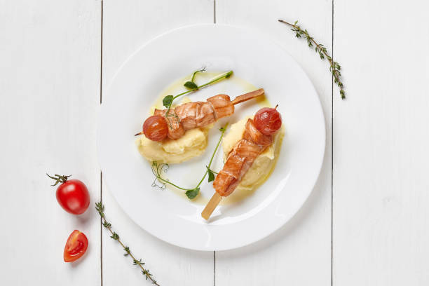 istock Baked salmon skewers with tomatoes and mashed potatoes 1323458247