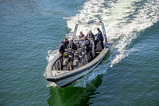 Danish police practicing in a speed boat in the harbor of central Copenhagen