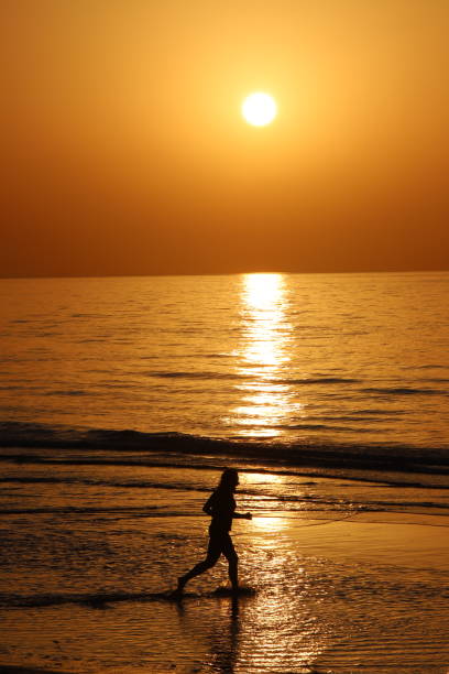 istock Girl playing at Beach in Oman 1323460029
