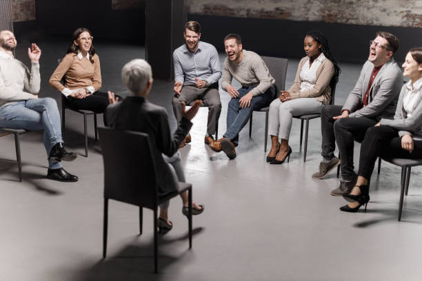 istock Cheerful entrepreneurs laughing during a group therapy in the office. 1323460163
