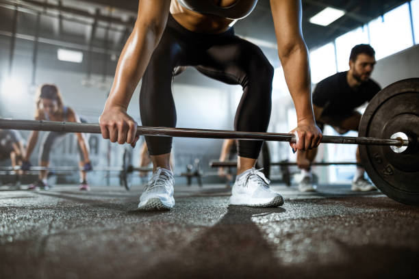 istock Unrecognizable female athlete exercising deadlift on cross training. 1323462113