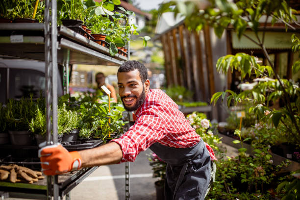 istock Garden center employee at work 1323462210