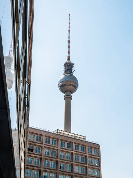 istock Berlin Television Tower from low angle during summer, germany 1323463035