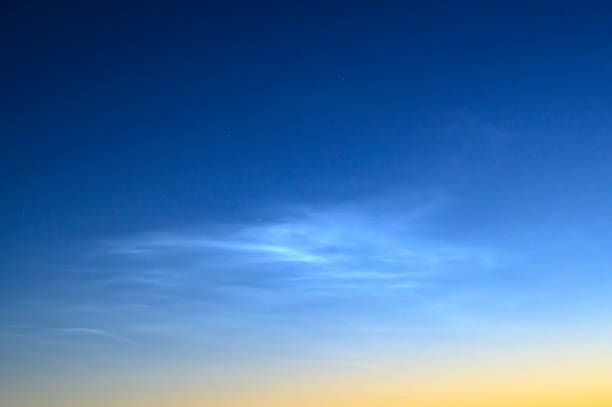 istock Noctilucent clouds or night shining clouds in the dark night sky 1323463569