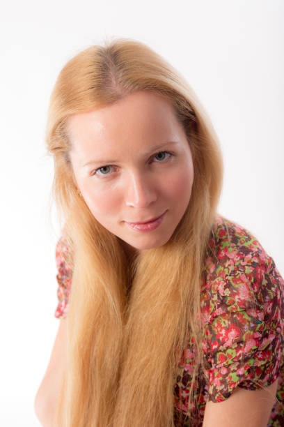 Portrait of a dyed blonde young pretty girl posing in the studio.
