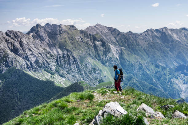 istock Hiker on top of the mountain 1323469942