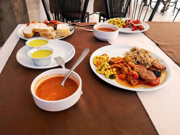 istock White plates with food on the table in a Turkish hotel restaurant 1323469961