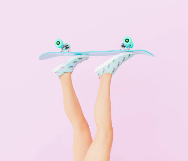 female legs with skateboard
