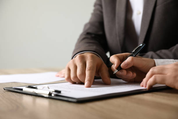 istock Businesspeople working with document at table indoors, closeup. Space for text 1323472860
