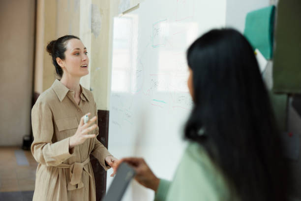 istock An entrepreneur exposing plans for a new business. 1323472921