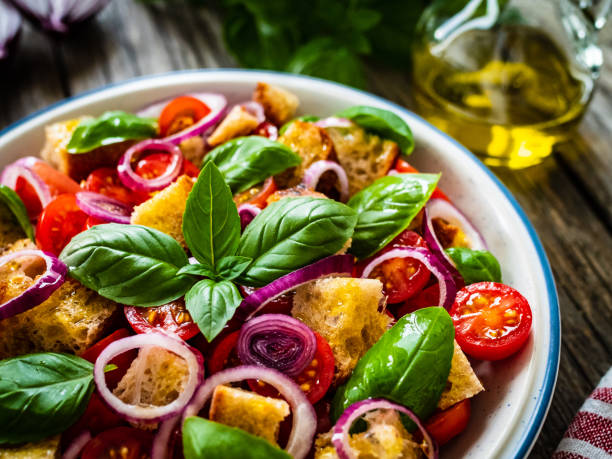 istock Classic panzanella salad on wooden board 1323476540