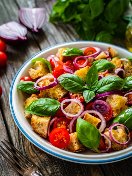 istock Classic panzanella salad on wooden board 1323476576