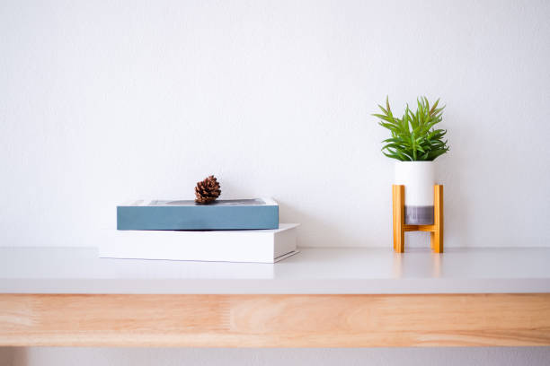istock Realistic artificial tree in vase and book with christmas decoration 1323476629