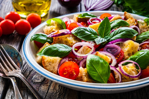 istock Classic panzanella salad on wooden board 1323476631