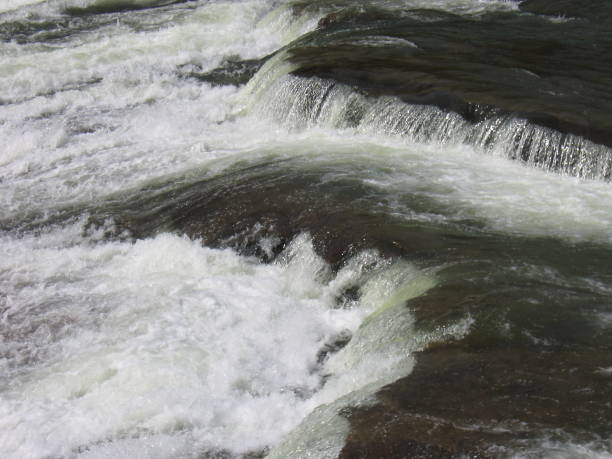istock Close-up of whitewater rapids over rocks 1323477105