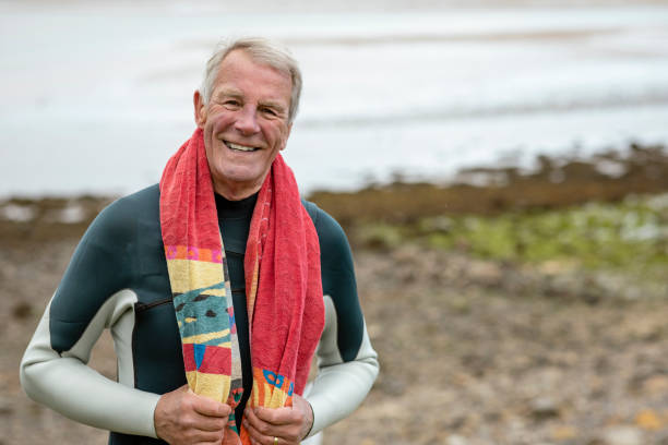 istock Senior Windsurfer by the Coast 1323480922