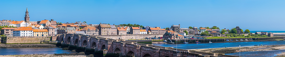 Old Bridge over the mouth of the River Tweed leading to the historic walled city of Berwick-upon-Tweed, Northumberland, UK.