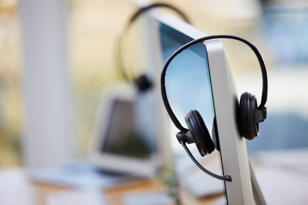 istock Shot of call center equipment in an empty office 1323482014