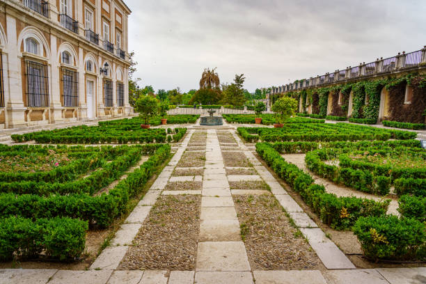 Gardens of the royal palace of Aranjuez in cloudy spring day. Aranjuez, Spain - June 5, 2021:
 Gardens of the royal palace of Aranjuez in cloudy spring day. Madrid. aranjuez stock pictures, royalty-free photos & images