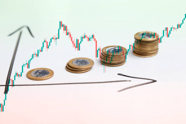 istock coins on white surface and arrows indicating time and earnings growth and candlestick 1323483151