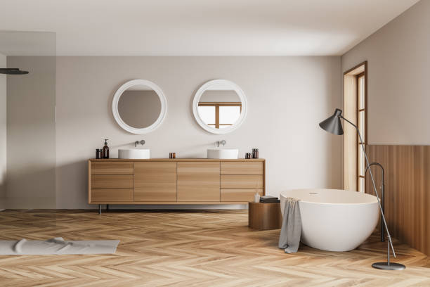 istock Bathroom interior with two sinks and bathtub with lamp 1323483990