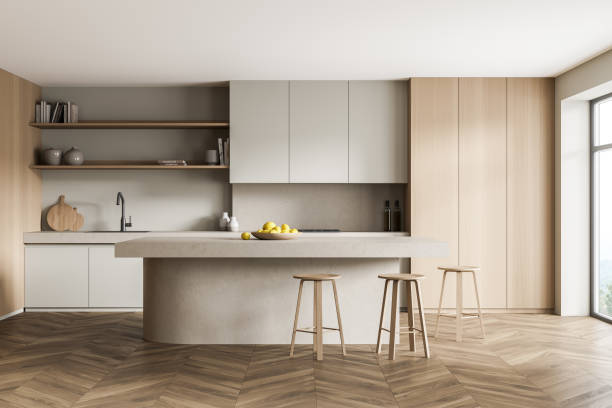 istock Light kitchen interior with table and chairs near window on parquet floor 1323484379