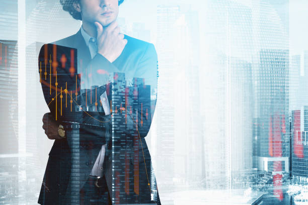 istock Prosperous trader in suit in crossed arms pose dreaming about po 1323485292