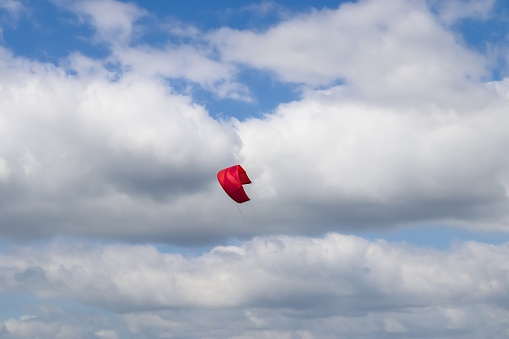 Lots of kite surfing activity at the Baltic Sea beach of Laboe in Germany on a sunny day.