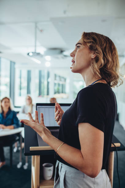 istock Entrepreneur giving a presentation to group of professionals 1323487611