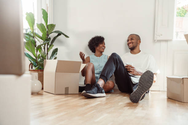 istock Happy couple moving into new house 1323488213