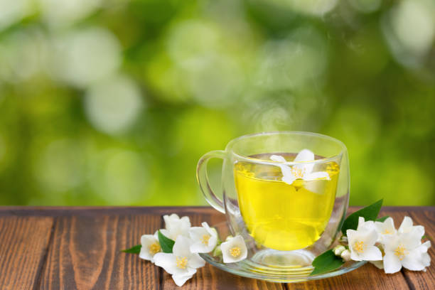 istock jasmine tea in glass cup with flowers 1323489087