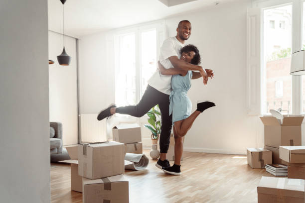 istock Happy couple moving into new house 1323489125
