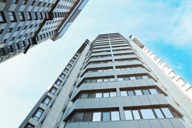 istock Beautiful modern buildings on sunny day, low angle view 1323489713
