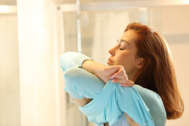 istock Woman undressing in the bathroom 1323490480